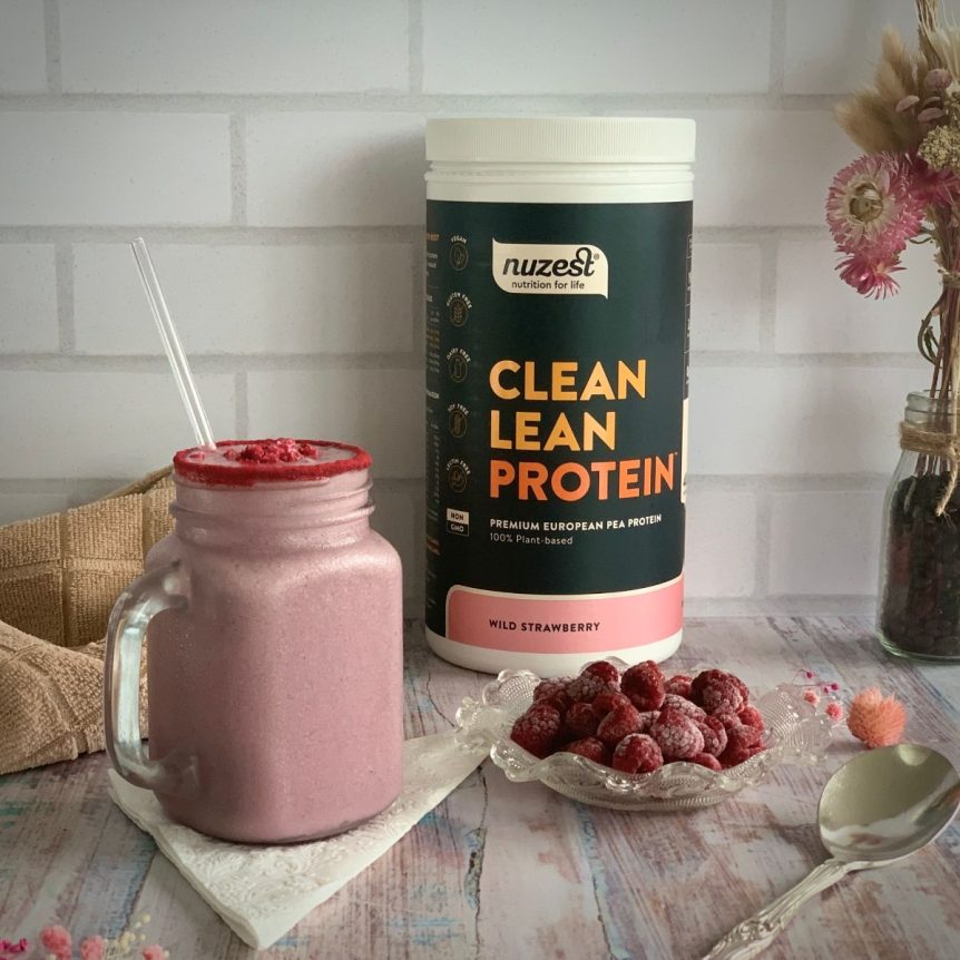 A jar of strawberry smoothie using Nuzest protein powder